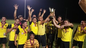 Club Hispanos holding up the Stampede Cup after their 2-1 win over Little Mexico FC.